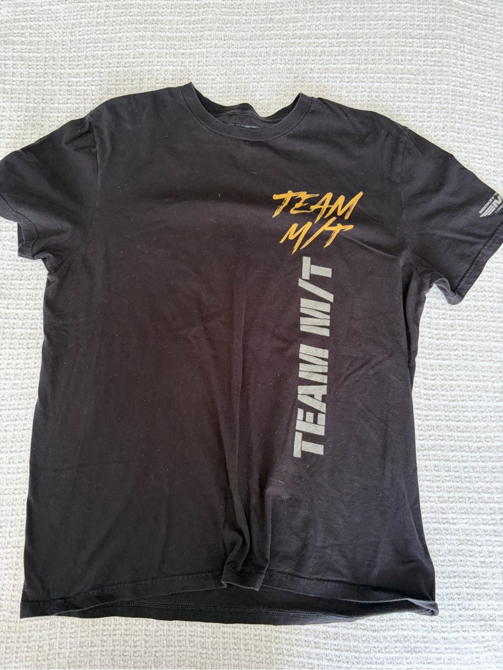 Black Short-Sleeve Team Graphic Tee with Yellow Accents